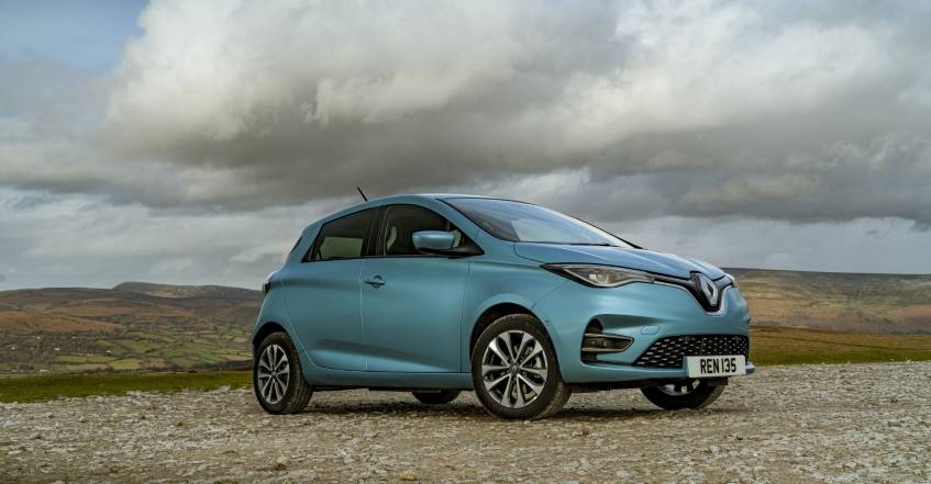 Powder blue 2 door Renault Zoe parked on a rural mountainside in daytime