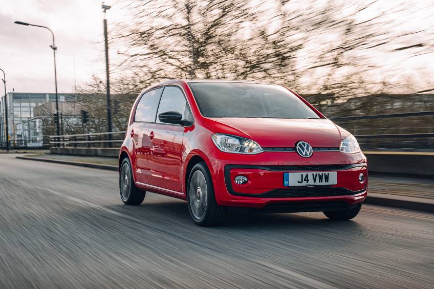 Red 4 door Volkswagen Up car